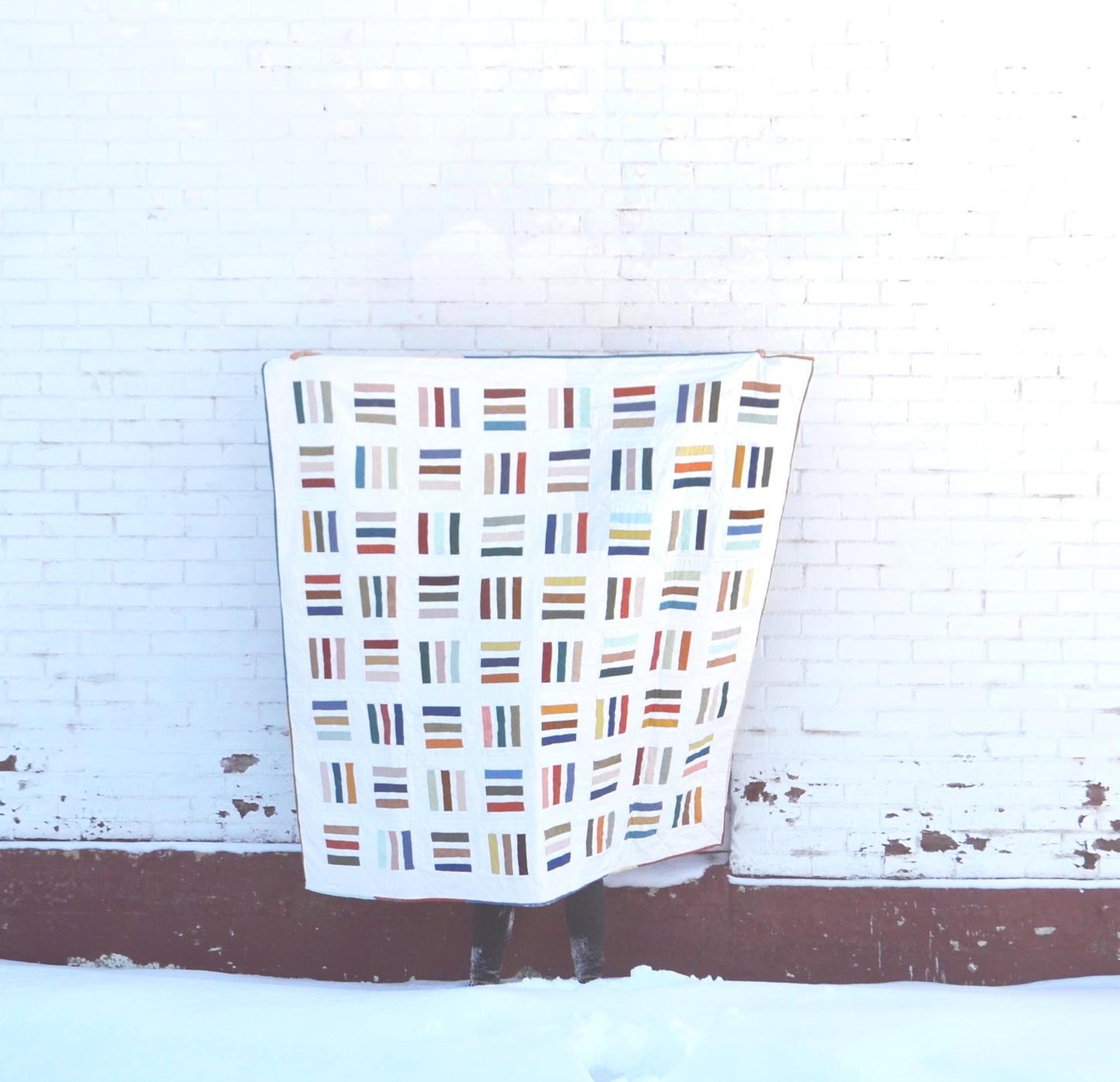 A modern quilt pattern using scrap fabrics or small lines